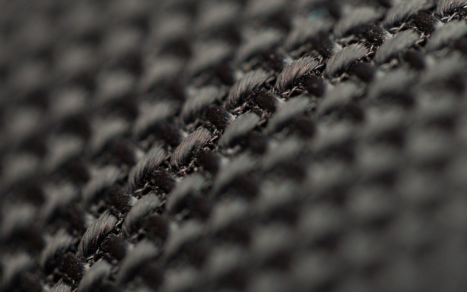 A woven technical fabric shot macro, raking light